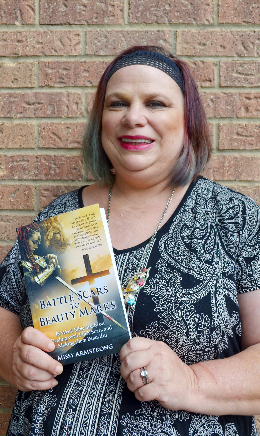 Missy Amrstrong with her new book, “Battle Scars to Beauty Marks.”
